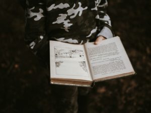 person holds book